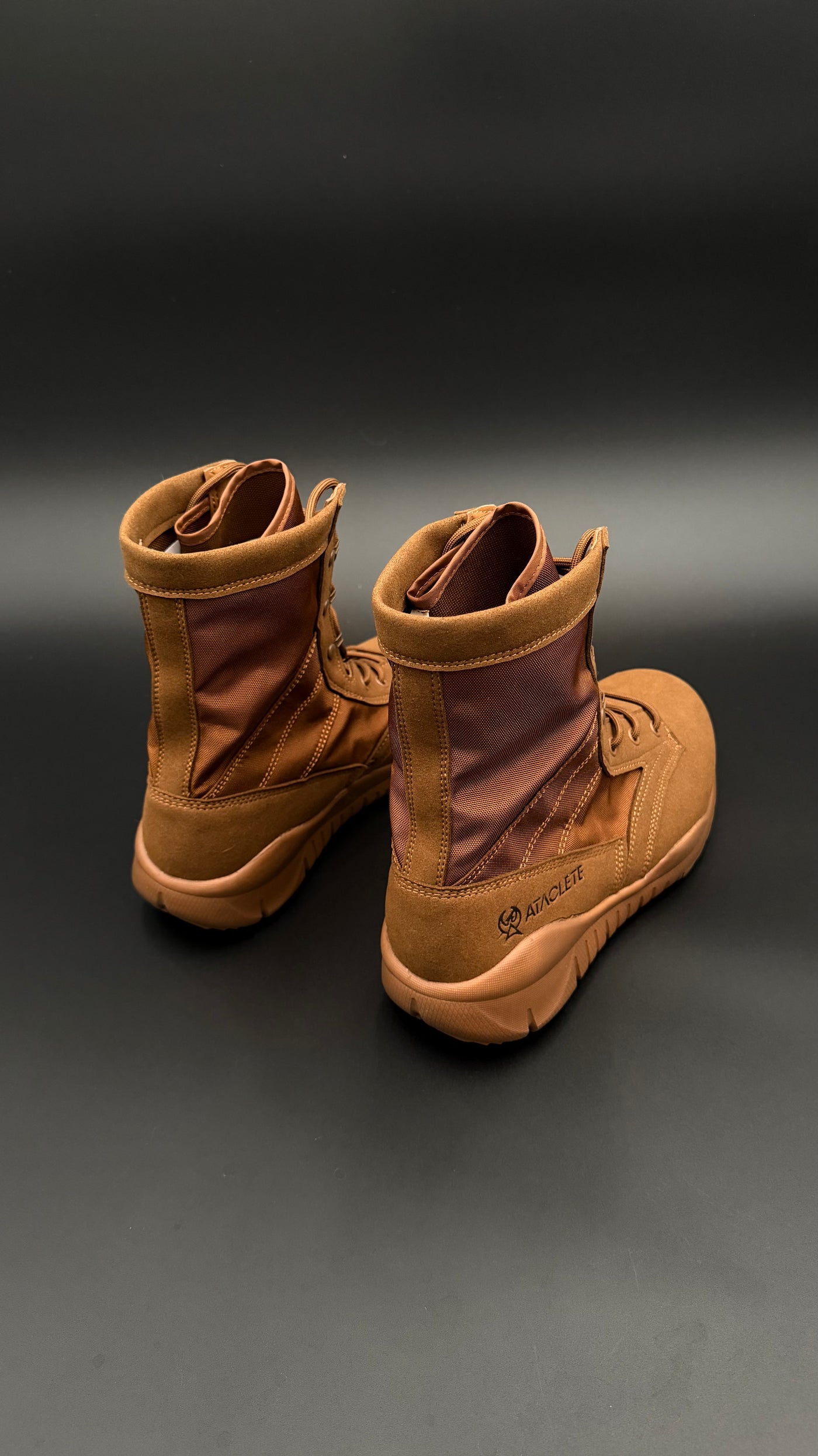 Pair of brown boots on a black background