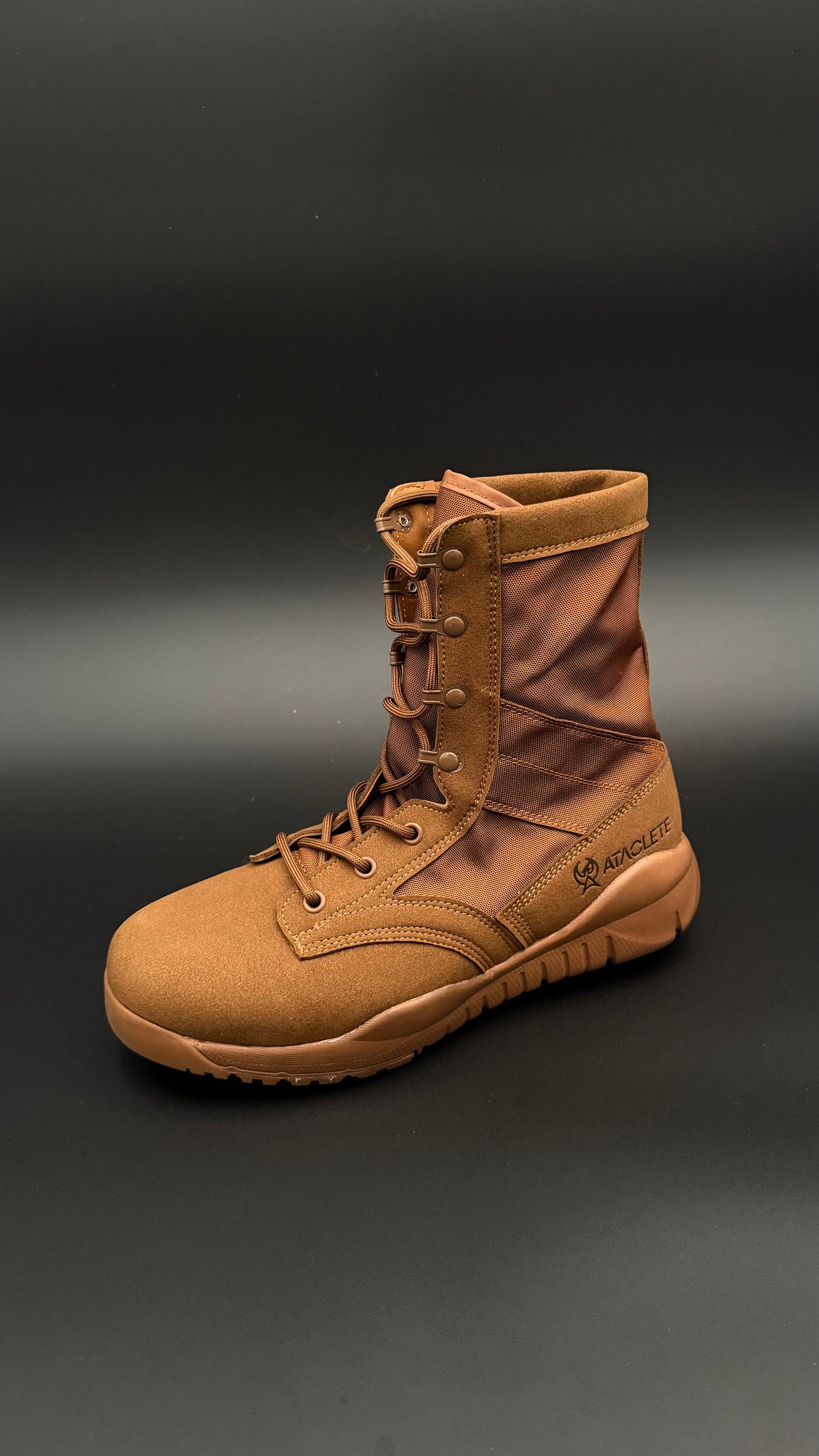Brown combat boot on a dark gray background